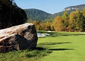 Hole one at Bright's Creek Golf Club in Mill Spring, North Carolina with views of the Blue Ridge Mountains