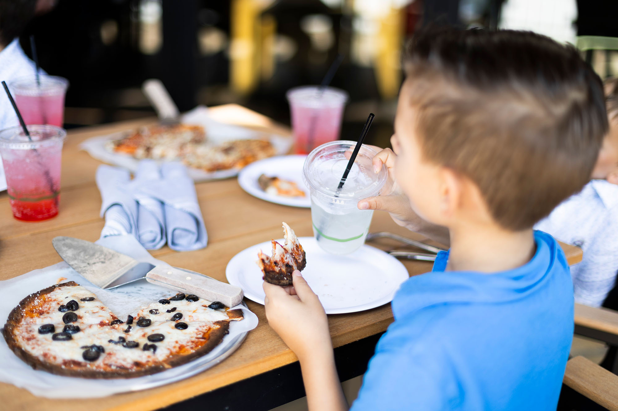 Kid eating pizza