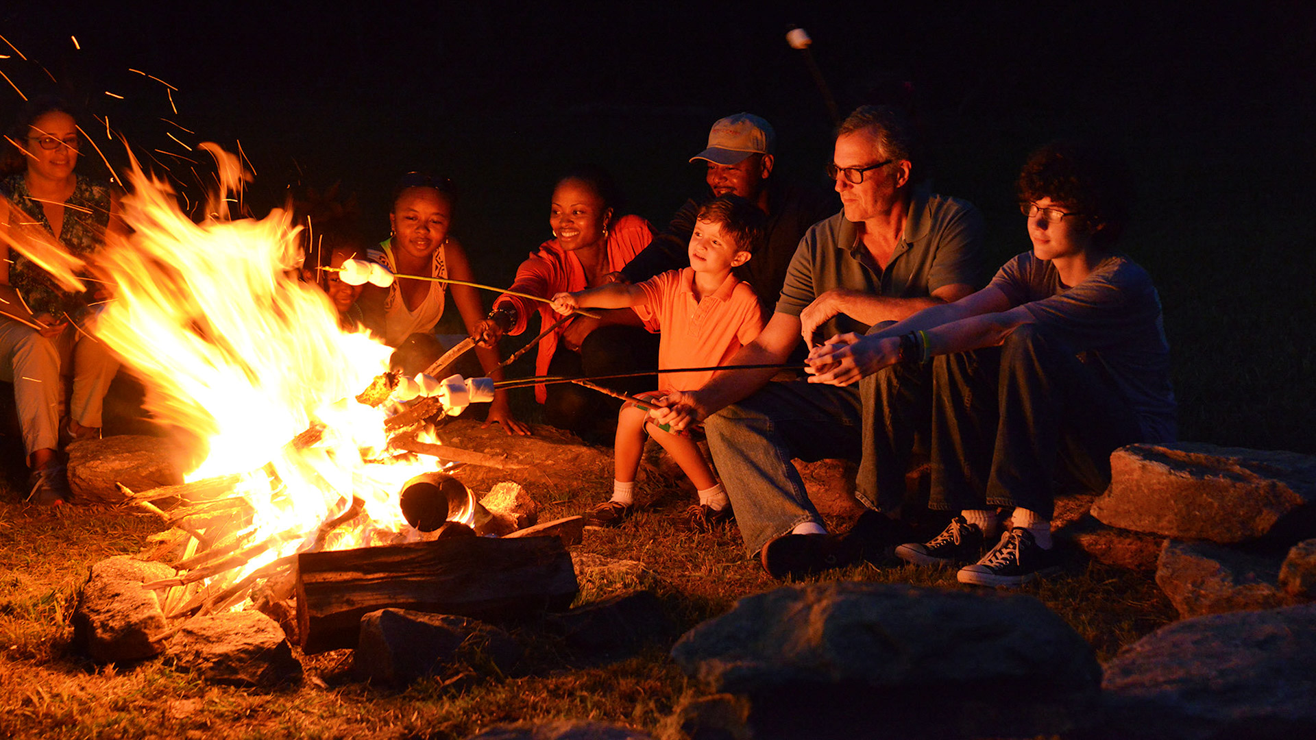 Families enjoying a campfire at Bright's Creek Club in Mill Spring, NC